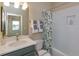 Well-appointed bathroom with a shower/tub combo and updated vanity at 13249 Peaceful Melody Dr, Winter Garden, FL 34787