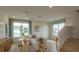 Open living room with a neutral color palette and lots of natural light at 13249 Peaceful Melody Dr, Winter Garden, FL 34787