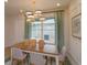 Bright dining room with a large window and elegant chandelier at 13249 Peaceful Melody Dr, Winter Garden, FL 34787