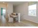 Upstairs landing with built-in desk and hardwood floors at 13249 Peaceful Melody Dr, Winter Garden, FL 34787