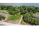 Lakefront lot with dock and lush vegetation at 3011 Indian Trl, Eustis, FL 32726