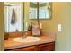 Bathroom with single sink vanity, mirror, and linen towels at 3011 Indian Trl, Eustis, FL 32726
