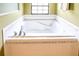 Bathroom featuring a large garden tub and updated tile at 3011 Indian Trl, Eustis, FL 32726