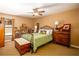 Bedroom with a queen bed, dresser, and built-in shelving at 3011 Indian Trl, Eustis, FL 32726