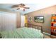 Bedroom with queen bed, large closet, and mounted TV at 3011 Indian Trl, Eustis, FL 32726