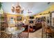 Charming dining area with glass-top table and wrought iron chairs near the kitchen at 3011 Indian Trl, Eustis, FL 32726