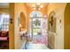 Bright and airy entryway with red door and view to backyard at 3011 Indian Trl, Eustis, FL 32726