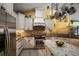 Bright kitchen with granite countertops and custom cabinetry at 3011 Indian Trl, Eustis, FL 32726