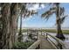 Wooden dock extending over calm lake water, offering serene waterfront views at 3011 Indian Trl, Eustis, FL 32726