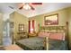 Main bedroom with a king-size bed and ensuite bathroom at 3011 Indian Trl, Eustis, FL 32726