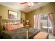 Large bedroom with a king-size bed and direct access to the backyard at 3011 Indian Trl, Eustis, FL 32726
