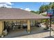 Covered patio with grill, ceiling fan, and outdoor seating at 3011 Indian Trl, Eustis, FL 32726
