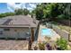 Inviting kidney-shaped pool with surrounding patio at 3011 Indian Trl, Eustis, FL 32726
