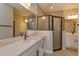 Modern bathroom with a large vanity, quartz countertop, and a walk-in shower at 5818 Camilla St, Saint Cloud, FL 34771