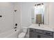 Modern bathroom with a shower tub combo, single vanity, and tiled walls at 5832 Springer St, Saint Cloud, FL 34771