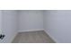 Spacious walk-in closet with wire shelving and plush carpeting at 905 Chasetree Ln, Saint Cloud, FL 34771