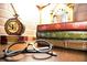 A stack of books and glasses on a wooden table at 4189 Paragraph Dr, Kissimmee, FL 34746