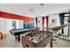 Game room with foosball, pool table, and Marvel theme at 4189 Paragraph Dr, Kissimmee, FL 34746