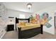 King-size bed in a bedroom with playful Pokemon wall art at 4189 Paragraph Dr, Kissimmee, FL 34746