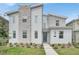Modern two-story home with stone accents at 4189 Paragraph Dr, Kissimmee, FL 34746