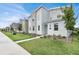 Modern home with stone and light colored exterior at 4189 Paragraph Dr, Kissimmee, FL 34746