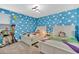 Toy Story-themed bedroom with twin beds and playful decor at 4189 Paragraph Dr, Kissimmee, FL 34746