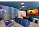 Home theater with projector and blue-themed decor at 4189 Paragraph Dr, Kissimmee, FL 34746
