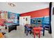 Game room with pool table, arcade games, and themed decor at 4189 Paragraph Dr, Kissimmee, FL 34746