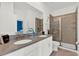 Modern bathroom with double vanity and shower at 4189 Paragraph Dr, Kissimmee, FL 34746