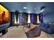 Home theater with projector, comfy seating and murals at 4189 Paragraph Dr, Kissimmee, FL 34746