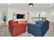Open game room with two sofas and a view of a bathroom at 4189 Paragraph Dr, Kissimmee, FL 34746