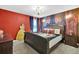 Elegant bedroom with a king-size bed and a beautiful themed mural at 4189 Paragraph Dr, Kissimmee, FL 34746