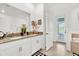 Double vanity bathroom with a soaking tub and access to backyard at 4189 Paragraph Dr, Kissimmee, FL 34746