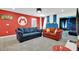 Relaxing game room with two sofas and Mario theme at 4189 Paragraph Dr, Kissimmee, FL 34746