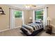 Bedroom with twin bed and window coverings at 12270 Virginia Dr, Leesburg, FL 34788