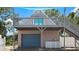 Guest house features a private deck, and a detached garage with an attached studio apartment at 12270 Virginia Dr, Leesburg, FL 34788