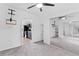 Bright bedroom with mirrored closet doors and access to kitchen at 12270 Virginia Dr, Leesburg, FL 34788