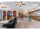 Modern kitchen with wood cabinets, island, and breakfast bar at 12270 Virginia Dr, Leesburg, FL 34788