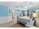 Main bedroom with light blue walls and ceiling fan at 12270 Virginia Dr, Leesburg, FL 34788