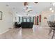 Open concept living room with views of kitchen and entryway at 12270 Virginia Dr, Leesburg, FL 34788
