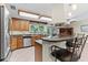 Spacious kitchen with stainless steel appliances and an island at 12270 Virginia Dr, Leesburg, FL 34788