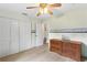 Bedroom with dresser and large closet at 12270 Virginia Dr, Leesburg, FL 34788