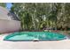 Relaxing kidney shaped pool in backyard at 12270 Virginia Dr, Leesburg, FL 34788