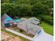 Aerial view of property showing house, pool, and surrounding landscape at 12270 Virginia Dr, Leesburg, FL 34788