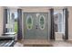 Bright entryway with double doors featuring stained glass at 12270 Virginia Dr, Leesburg, FL 34788