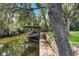 Boat shelter on a wooden dock along a tranquil waterway at 12270 Virginia Dr, Leesburg, FL 34788