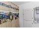 Small bathroom with nautical shower curtain and white cabinet at 12270 Virginia Dr, Leesburg, FL 34788