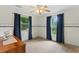 Bedroom with two windows and sailboat theme at 12270 Virginia Dr, Leesburg, FL 34788