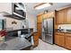 Kitchen with stainless steel appliances and dark countertops at 12270 Virginia Dr, Leesburg, FL 34788