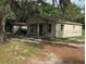 A small house with a yard at 1605 Rose Ln, Eustis, FL 32726
